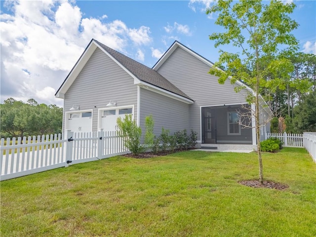 206 Placid Rd, Saint Marys, GA 31558 - back of house featuring a sunroom, an attached garage, and a shingled roof