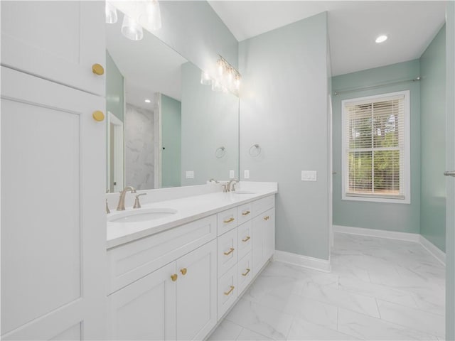 206 Placid Rd, Saint Marys, GA 31558 - bathroom with double vanity, marble finish flooring, recessed lighting, and a marble finish shower