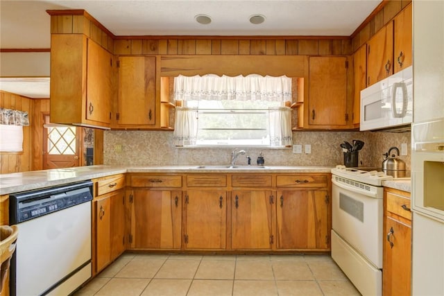 706 Jenkins St, Blackshear, GA 31516 - kitchen with white appliances, light countertops, and decorative backsplash