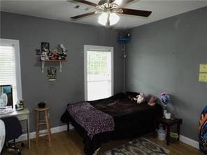 105 Lonnie Johnson Rd, Hazlehurst, GA 31539 - bedroom with wood finished floors and a ceiling fan