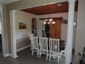 105 Lonnie Johnson Rd, Hazlehurst, GA 31539 - dining room featuring decorative columns, a chandelier, wooden ceiling, and arched walkways