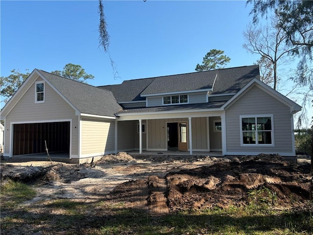 view of front of house with a garage and covered porch