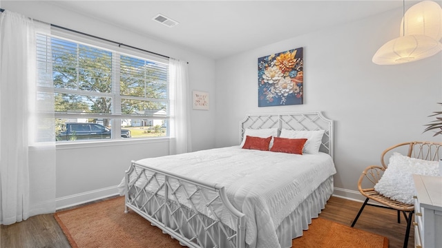 1037 Lakes Blvd, Brunswick, GA 31525 - bedroom with wood finished floors