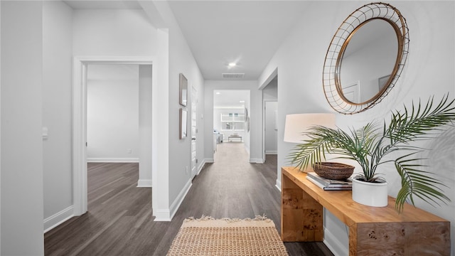 1037 Lakes Blvd, Brunswick, GA 31525 - corridor featuring dark wood-style floors and baseboards