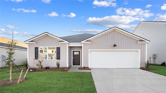 1037 Lakes Blvd, Brunswick, GA 31525 - view of front of home featuring driveway, a garage, a front lawn, and board and batten siding