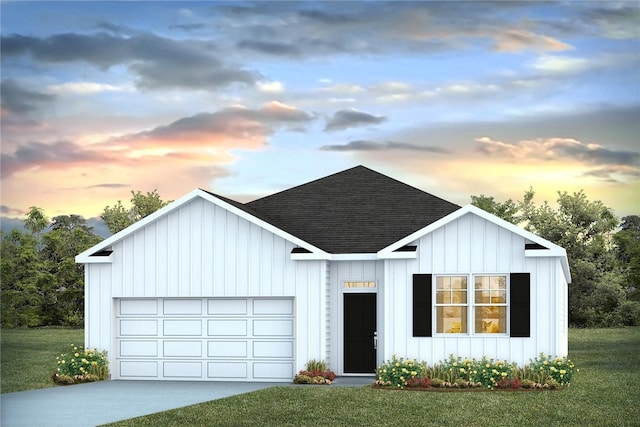 1037 Lakes Blvd, Brunswick, GA 31525 - modern inspired farmhouse featuring a shingled roof, a garage, driveway, and a lawn