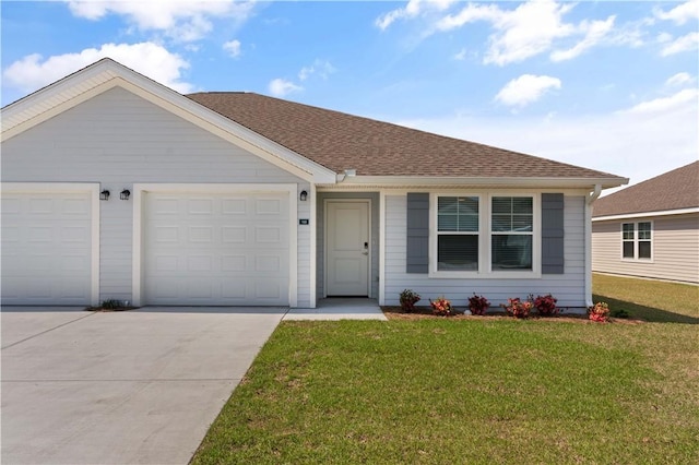 ranch-style home with a front yard and a garage