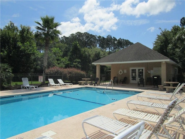 view of swimming pool featuring a patio area