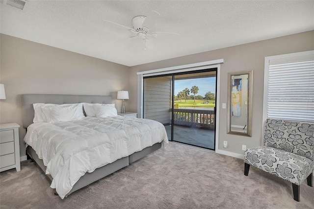 carpeted bedroom featuring ceiling fan, access to outside, and a textured ceiling