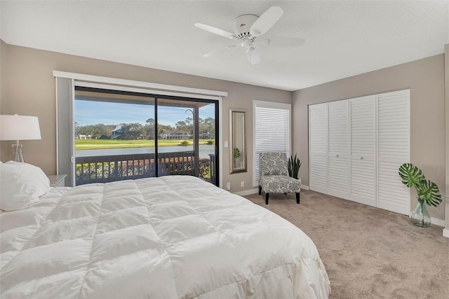 bedroom with ceiling fan, carpet floors, a closet, and access to outside