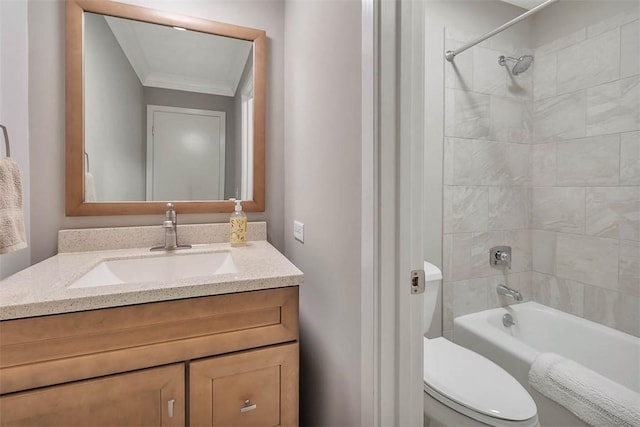 full bathroom with tiled shower / bath, vanity, and toilet