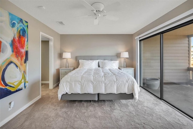 carpeted bedroom with ceiling fan and a closet