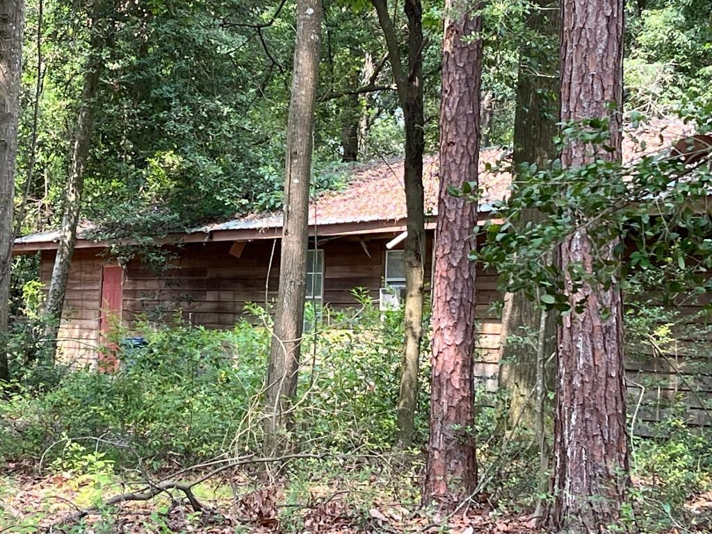 774 E Plum St, Jesup, GA 31546 - view of outdoor structure featuring a wooded view