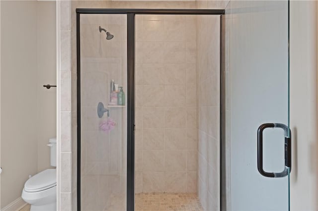 bathroom with toilet and walk in shower