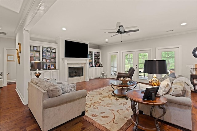 living room featuring ceiling fan, crown molding, dark wood-type flooring, and french doors