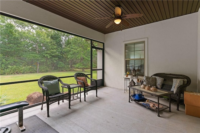 sunroom / solarium featuring ceiling fan and wooden ceiling