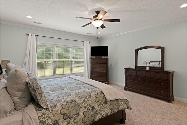 bedroom featuring a textured ceiling, ceiling fan, ornamental molding, and light carpet