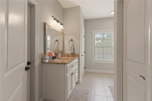 bathroom featuring tile patterned floors and vanity