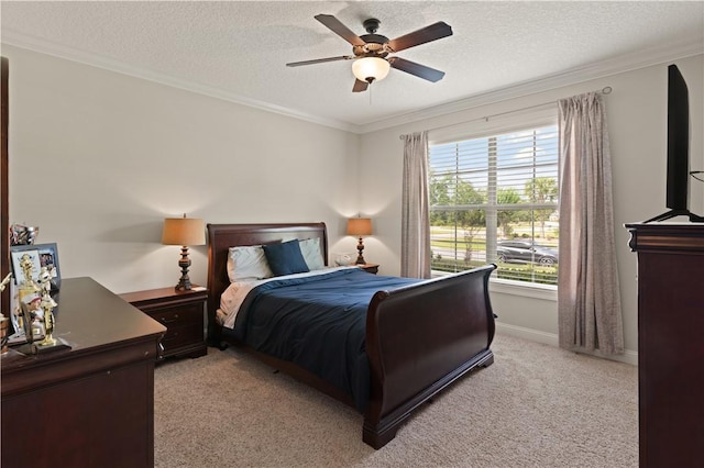 bedroom featuring ceiling fan, light colored carpet, ornamental molding, and a textured ceiling