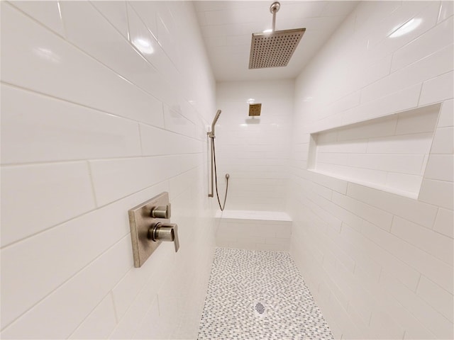 bathroom with a tile shower