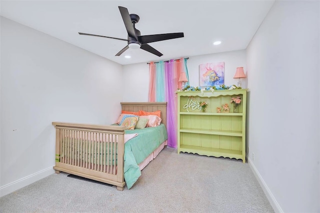 carpeted bedroom featuring recessed lighting, baseboards, and a ceiling fan