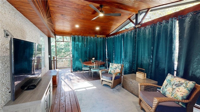 sunroom featuring vaulted ceiling with beams, wooden ceiling, and ceiling fan