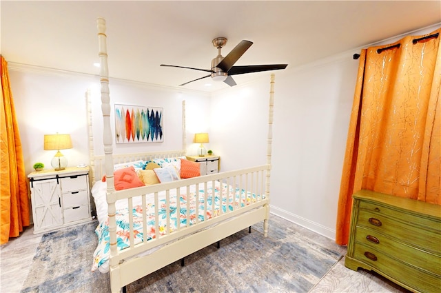 bedroom with ceiling fan, ornamental molding, and wood-type flooring