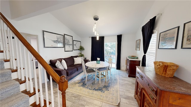 living room featuring vaulted ceiling