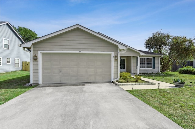 ranch-style house featuring driveway, a front lawn, and a garage