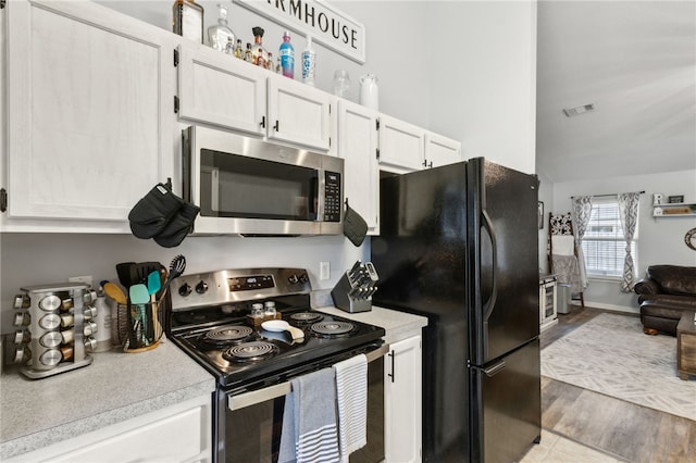 kitchen with visible vents, white cabinets, appliances with stainless steel finishes, and light countertops
