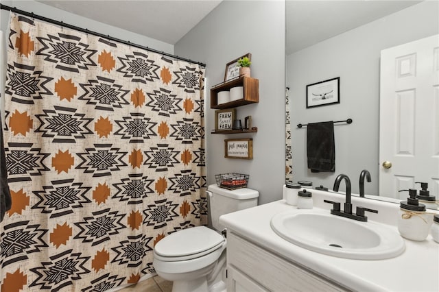 full bath featuring toilet and vanity