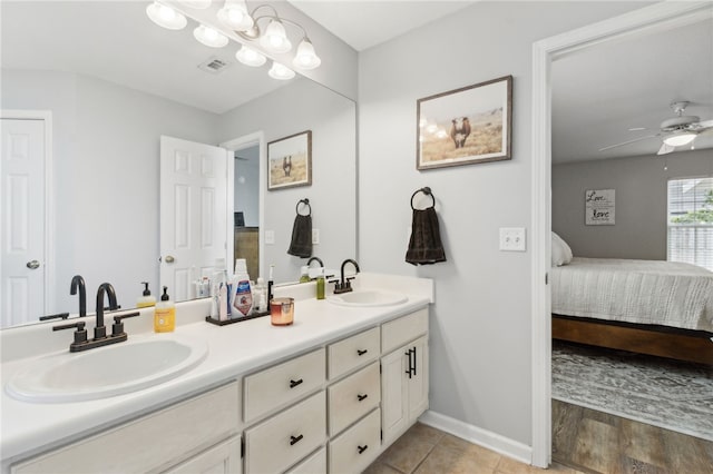 full bathroom with ensuite bathroom, a sink, ceiling fan, and visible vents
