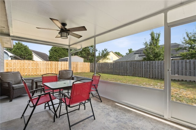 exterior space featuring outdoor dining space, ceiling fan, and a fenced backyard