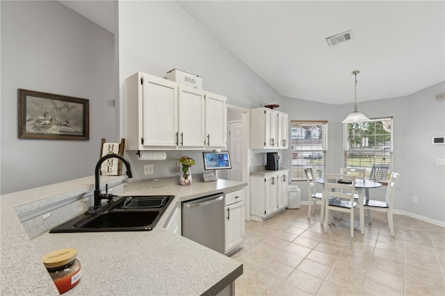 kitchen with white cabinetry, light countertops, stainless steel dishwasher, and a sink