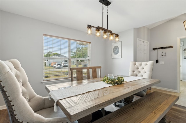 dining room featuring wood finished floors and baseboards