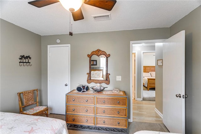 850 Mallery St Unit 4S, Saint Simons Island, GA 31522 - bedroom with light colored carpet and a ceiling fan