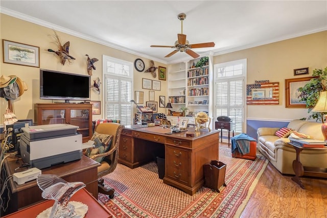 office space featuring ceiling fan, ornamental molding, and a wealth of natural light