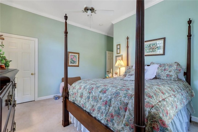 bedroom featuring light carpet, ceiling fan, baseboards, and crown molding