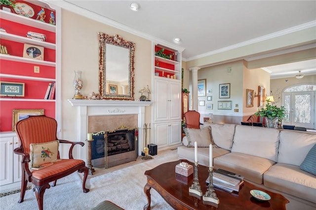 living area featuring ornamental molding, a premium fireplace, light colored carpet, and ornate columns