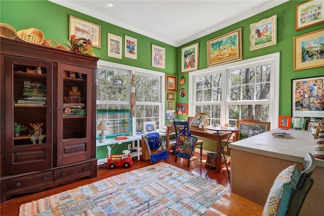 office area with ornamental molding and wood finished floors