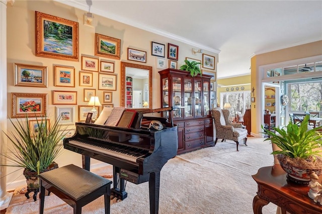 living area featuring ornamental molding and carpet flooring