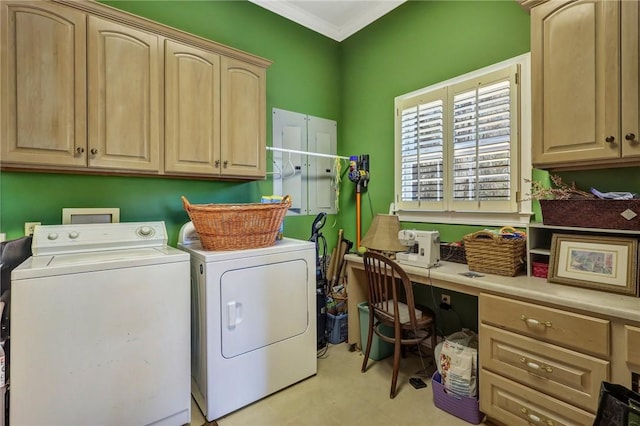 laundry area with separate washer and dryer, cabinet space, and crown molding