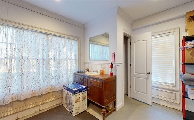 bathroom featuring concrete flooring and sink