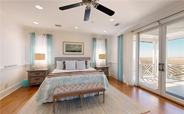 bedroom with access to exterior, ceiling fan, light hardwood / wood-style flooring, and ornamental molding