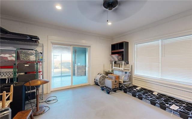 941 Champney, Saint Simons Island, GA 31522 - misc room with ornamental molding, concrete flooring, and ceiling fan
