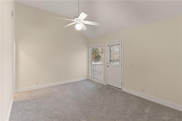 662 N Golf Villas Dr, Saint Simons Island, GA 31522 - unfurnished room with vaulted ceiling, carpet floors, a ceiling fan, and baseboards