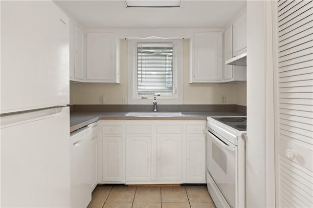 662 N Golf Villas Dr, Saint Simons Island, GA 31522 - kitchen with white appliances, a sink, white cabinetry, and under cabinet range hood
