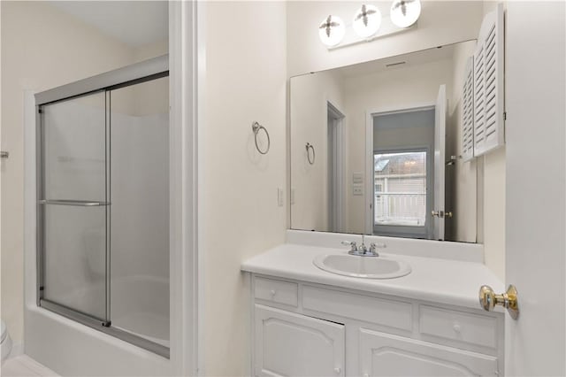 662 N Golf Villas Dr, Saint Simons Island, GA 31522 - full bath with toilet, vanity, and bath / shower combo with glass door