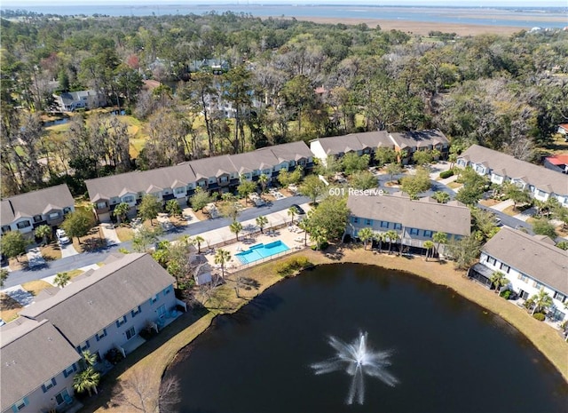 bird's eye view featuring a residential view and a water view