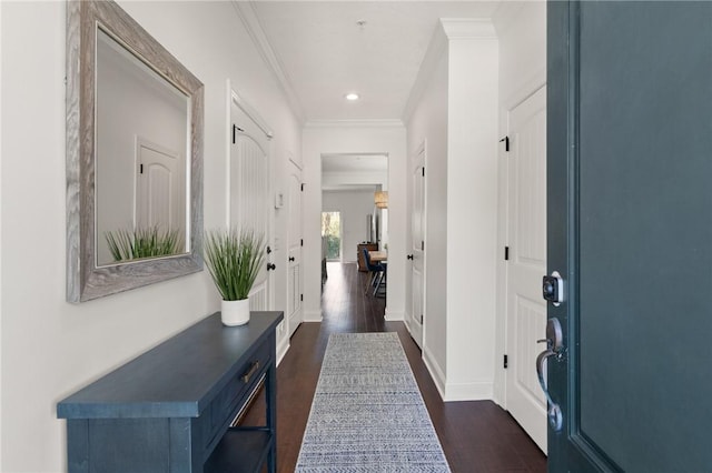 corridor featuring recessed lighting, baseboards, ornamental molding, and dark wood-style flooring